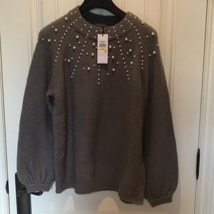 New with tag. Calvin Klein sweater with pearl